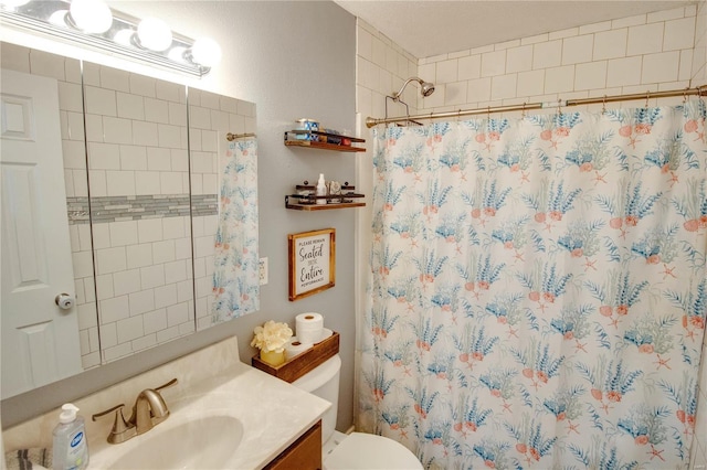 bathroom with vanity, toilet, and a shower with shower curtain