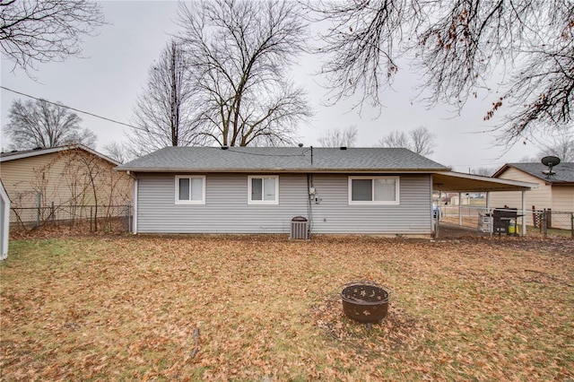 rear view of house with a yard