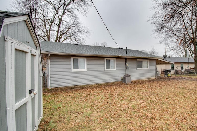 rear view of house with a lawn