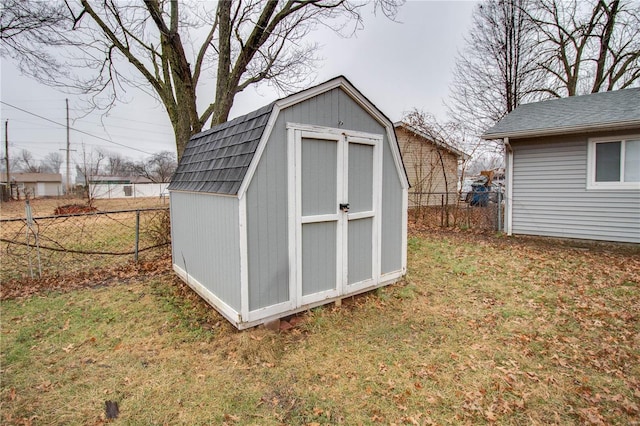 view of outdoor structure featuring a lawn