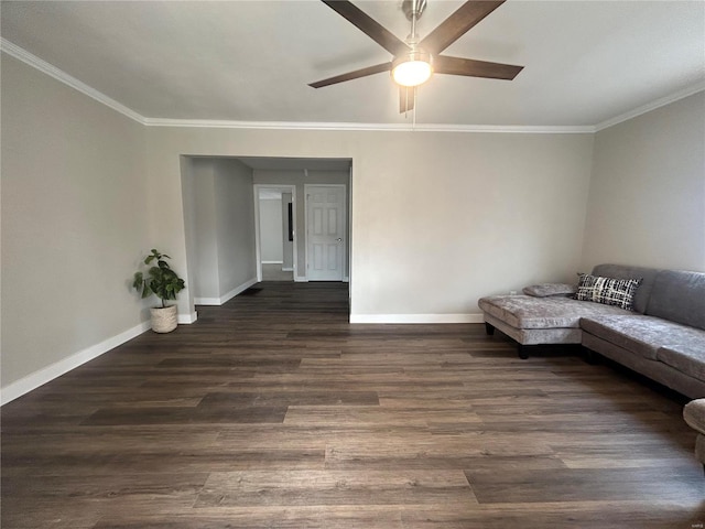 unfurnished living room featuring crown molding, ceiling fan, and dark hardwood / wood-style floors