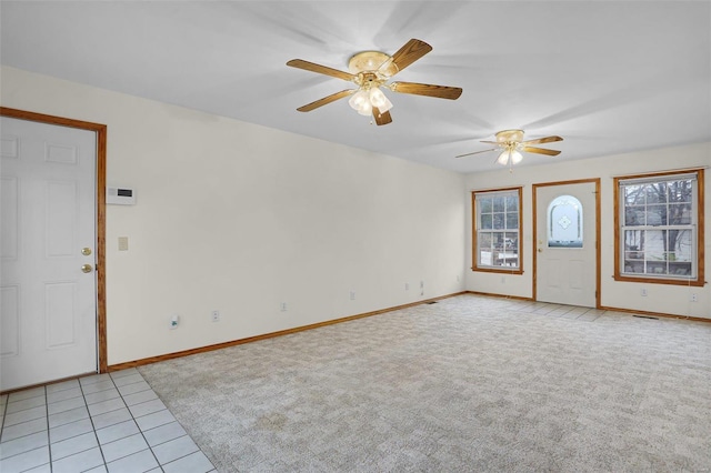 interior space with light colored carpet and ceiling fan