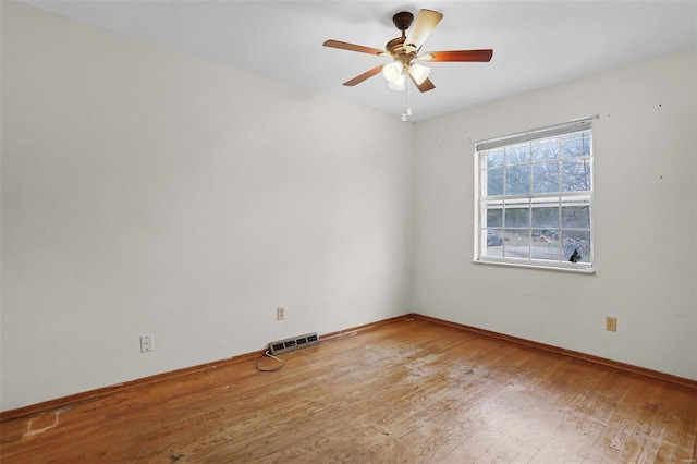 spare room featuring ceiling fan and wood-type flooring