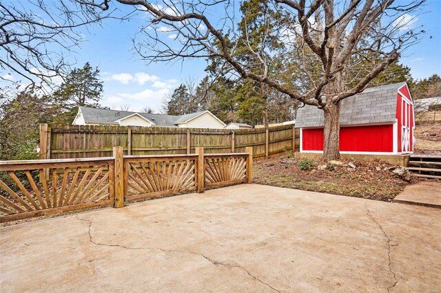 view of patio / terrace featuring a shed