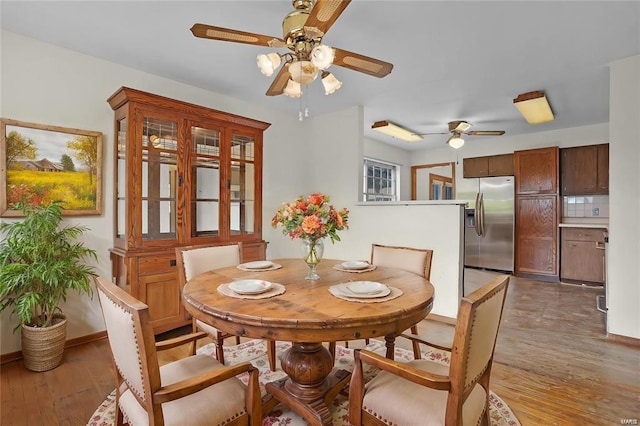 dining area with dark wood-type flooring