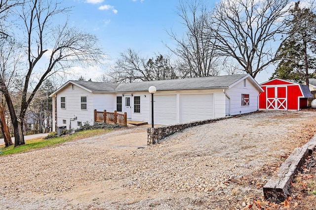 single story home featuring a garage and a deck