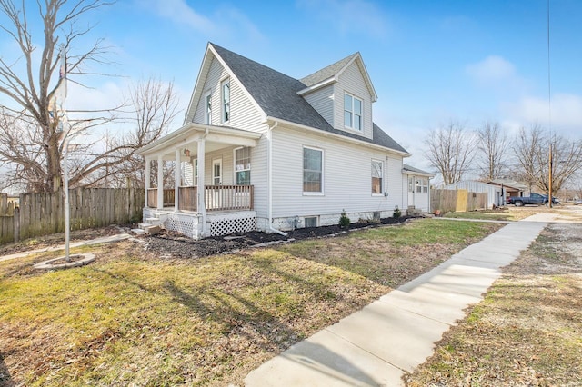 view of home's exterior with a lawn and a porch