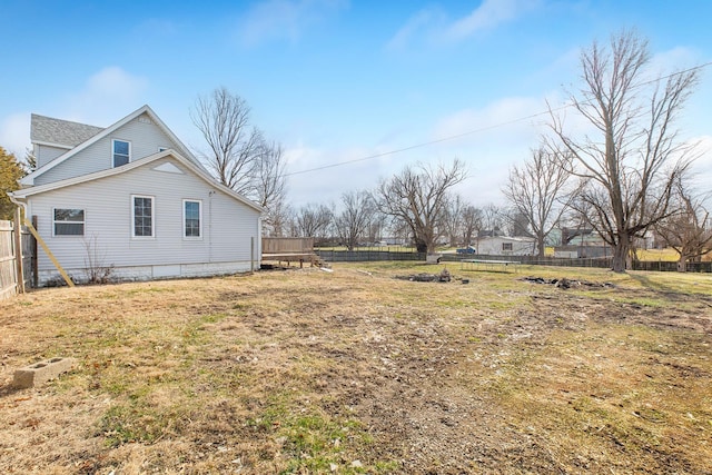 view of side of home featuring a yard