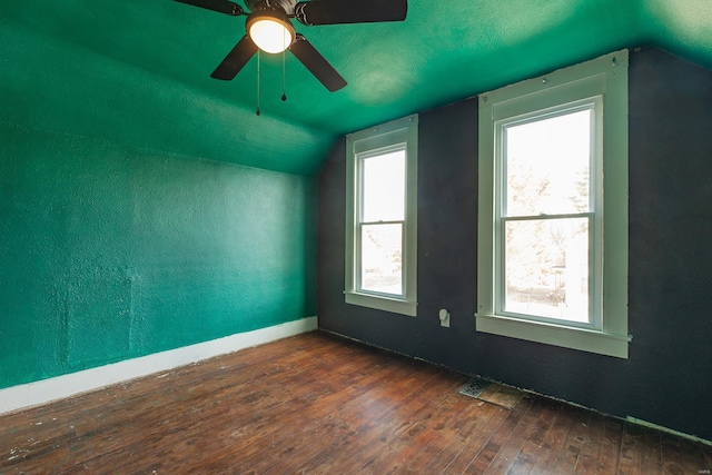 additional living space featuring vaulted ceiling, dark hardwood / wood-style floors, a textured ceiling, and ceiling fan