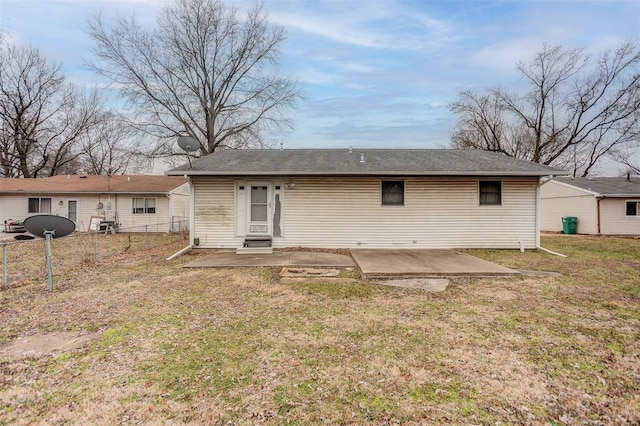 back of house with a yard and a patio area