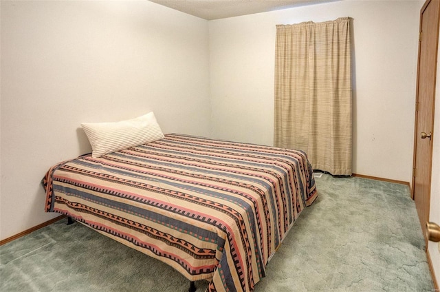 bedroom featuring light colored carpet