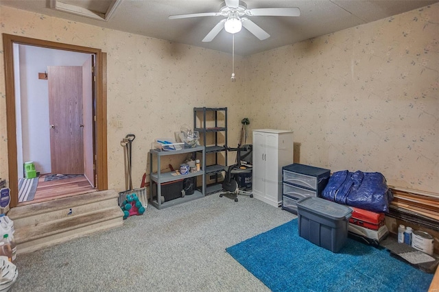 misc room with ceiling fan and carpet flooring