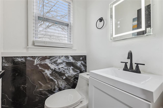 bathroom with vanity and toilet