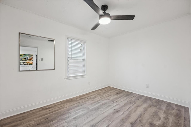 empty room featuring ceiling fan and light hardwood / wood-style flooring