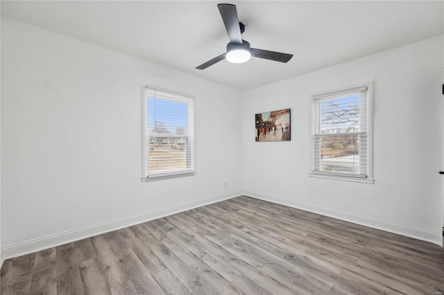 spare room featuring ceiling fan and light hardwood / wood-style floors