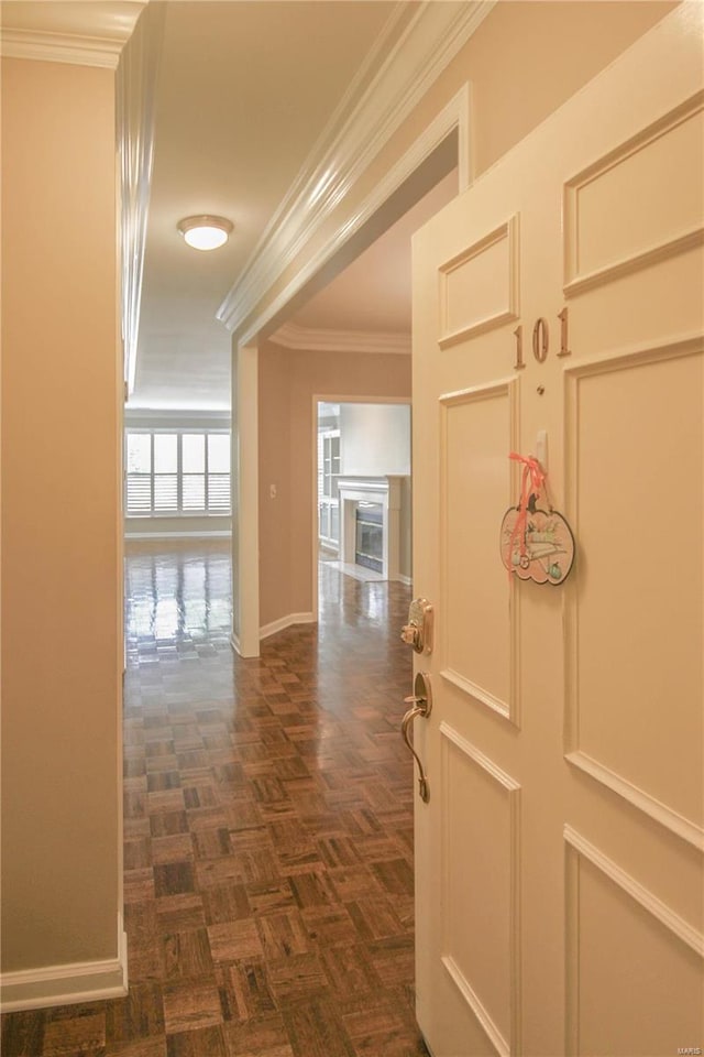 corridor with crown molding and dark parquet floors