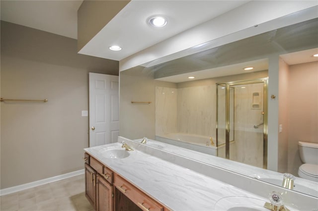 bathroom with vanity, toilet, and a shower with shower door