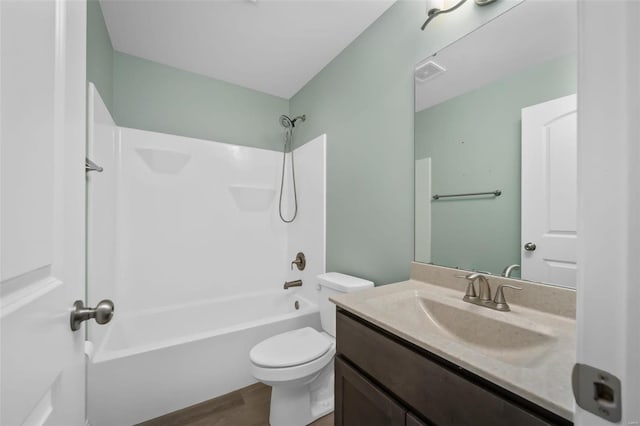 full bath with shower / bath combination, visible vents, toilet, vanity, and wood finished floors