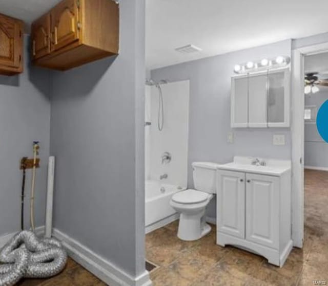 full bathroom featuring vanity, ceiling fan, bathtub / shower combination, and toilet