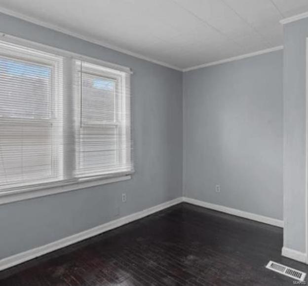 unfurnished room with crown molding and dark hardwood / wood-style floors