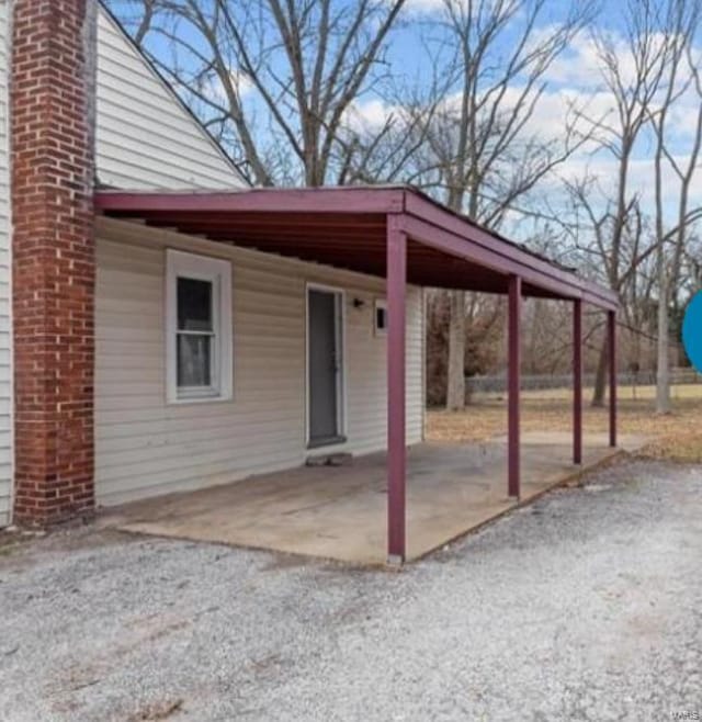 exterior space featuring a carport