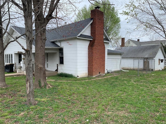 view of property exterior with a yard