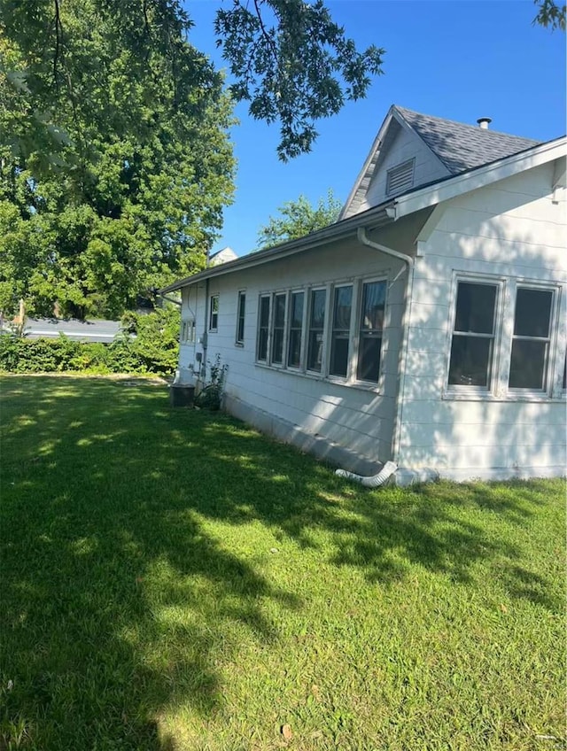 view of home's exterior featuring a yard