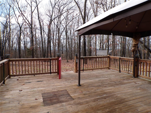 wooden deck featuring a gazebo