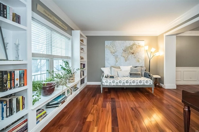 sitting room with ornamental molding, dark hardwood / wood-style floors, and built in shelves