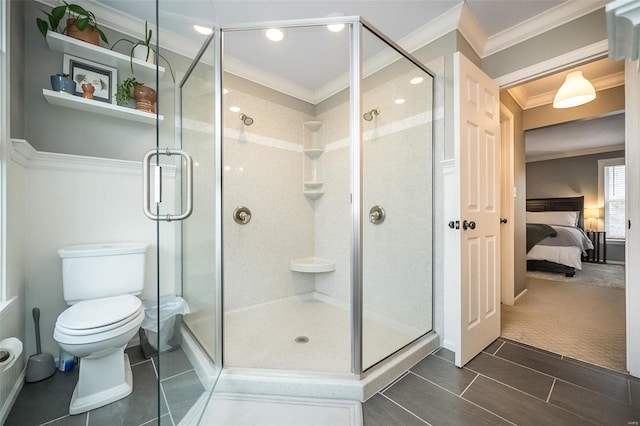 bathroom with crown molding, toilet, tile patterned flooring, and walk in shower