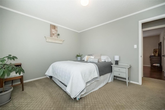 bedroom featuring crown molding and carpet