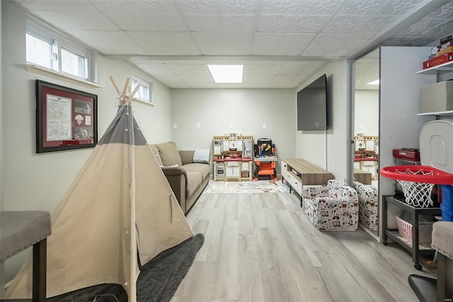 playroom featuring light wood-type flooring