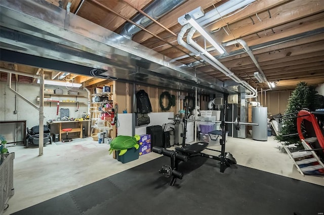 workout room featuring water heater and a workshop area