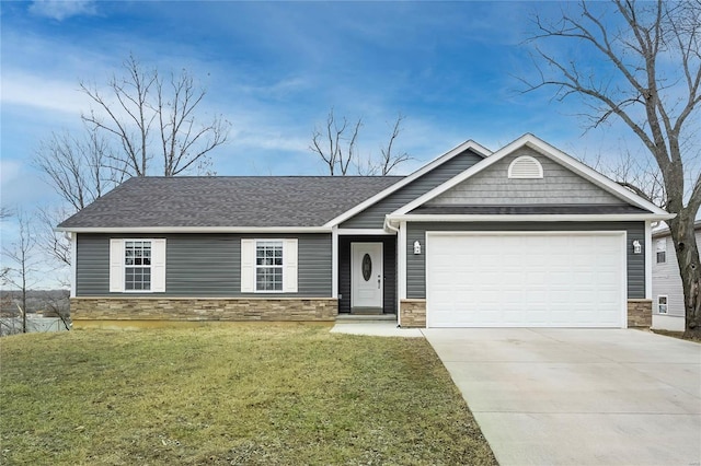 view of front facade with a garage and a front yard