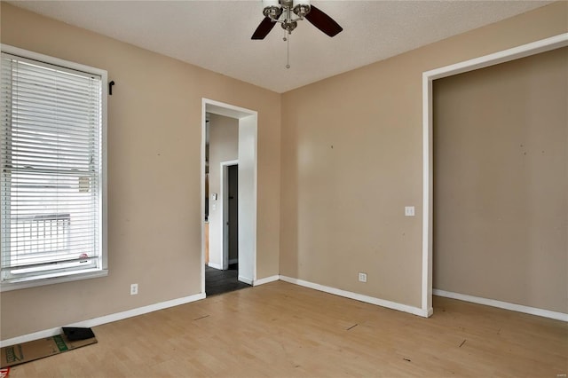 unfurnished bedroom with hardwood / wood-style flooring and ceiling fan