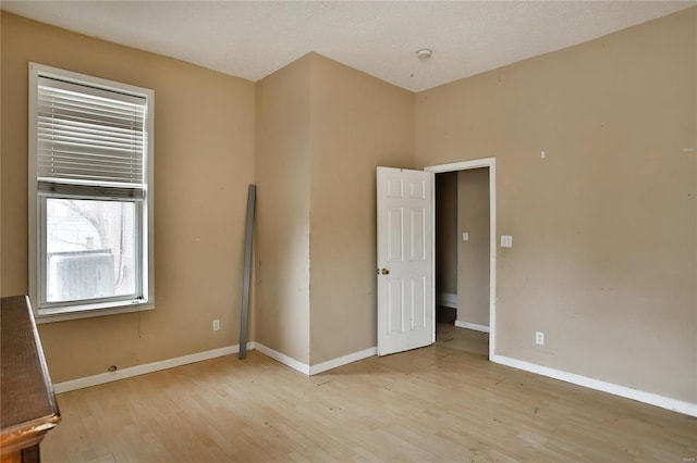 empty room with light hardwood / wood-style floors