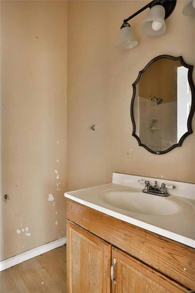 bathroom featuring wood-type flooring and vanity