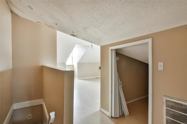 bonus room featuring light hardwood / wood-style floors and vaulted ceiling