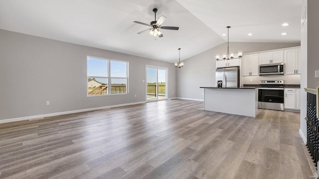 kitchen featuring pendant lighting, a center island, white cabinets, and appliances with stainless steel finishes