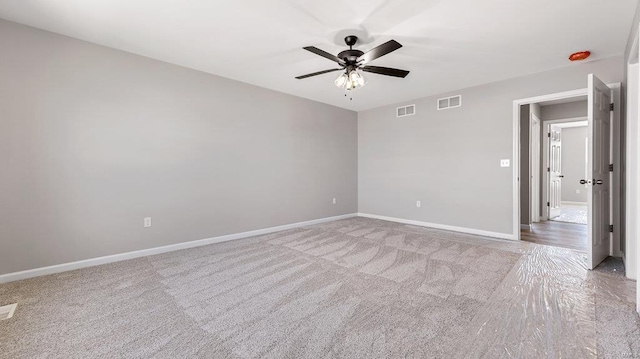 unfurnished room with ceiling fan and carpet flooring