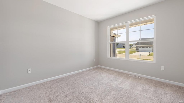 unfurnished room with carpet floors