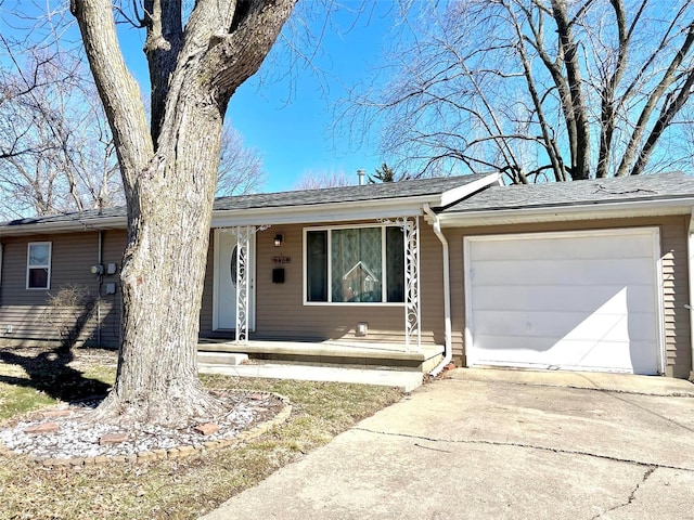 ranch-style house with a garage, driveway, and a porch