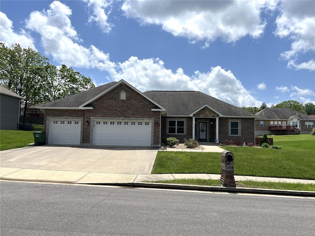 view of front of house featuring a garage and a front lawn