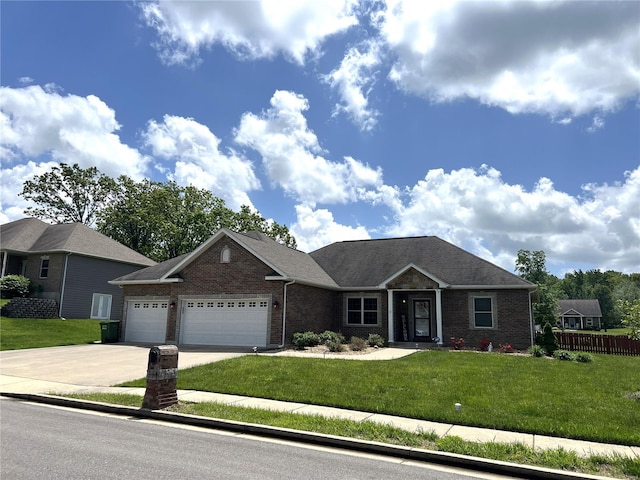 view of front of home with a garage and a front yard