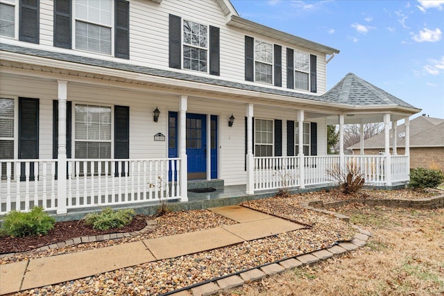 country-style home featuring a porch