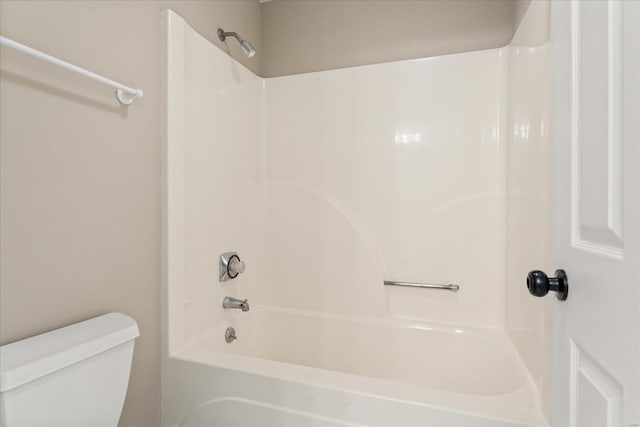 bathroom with shower / bath combination and toilet