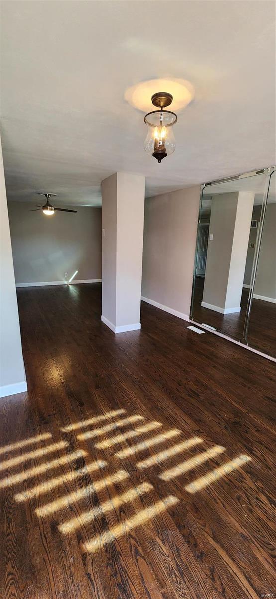 spare room featuring dark hardwood / wood-style floors