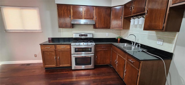 kitchen featuring double oven range, sink, backsplash, and dark hardwood / wood-style floors