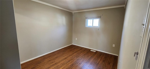 empty room featuring ornamental molding and hardwood / wood-style floors