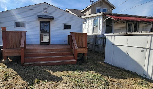 rear view of property featuring a deck